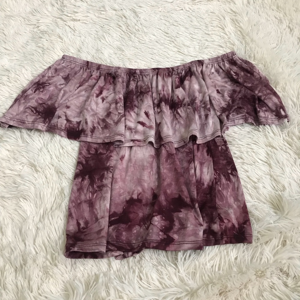 A tie dye purple off the shoulder shirt